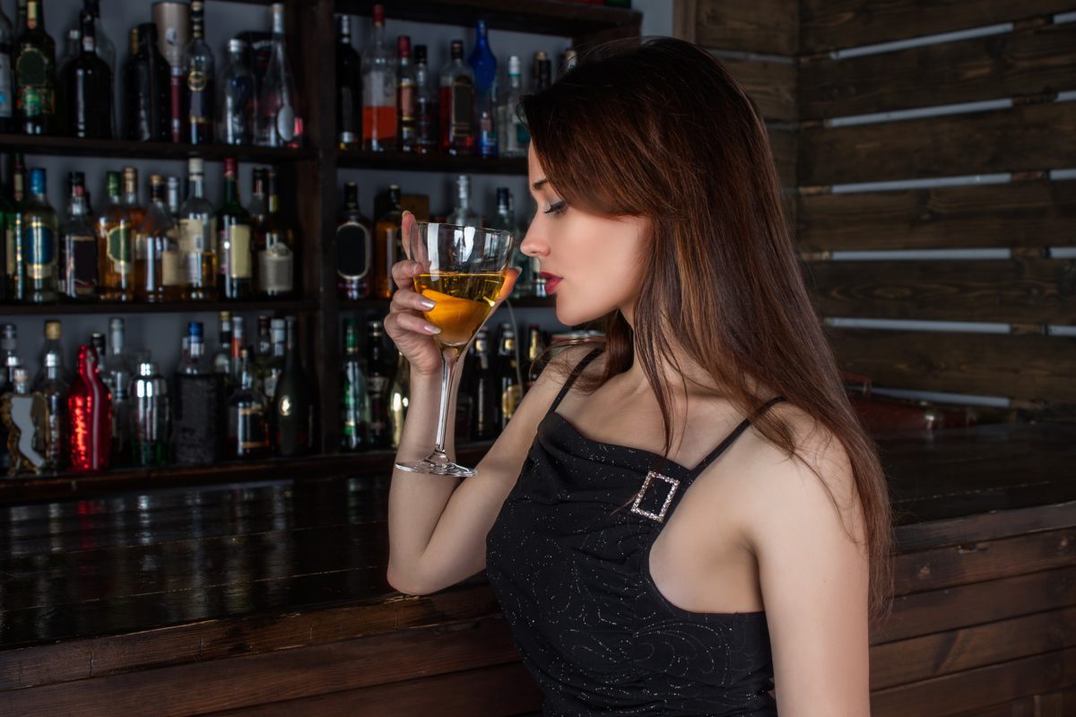 beautiful-girl-tasting-white-wine-in-bar